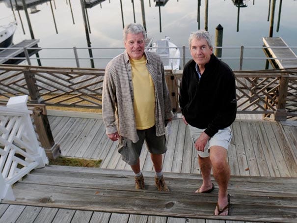 Seascape property owner Mike Mickiewicz (left) and resident Scott Sullivan stand in front Seascape Marina in Holden Beach on March 16, 2012. The marina that was built in 2003 has several serious engineering problems.