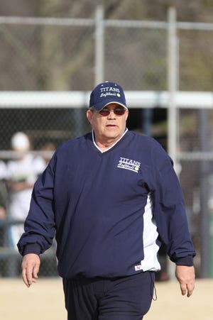 Monmouth-Roseville softball coach Tom Casteel watches the action last season.