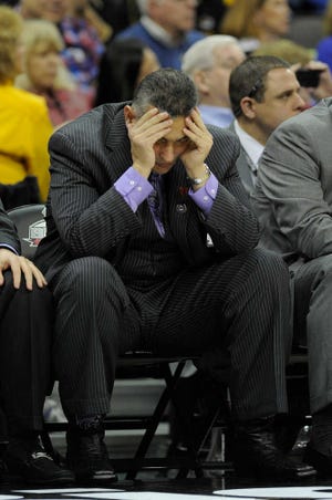 Kansas State coach Frank Martin, dejected here after his team's loss to Baylor in the Big 12 semifinals, now must decide if he'll break the hearts of his Kansas State fans by accepting an apparent job overture from South Carolina.