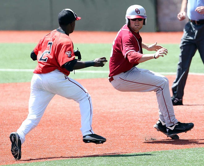 Texas Tech's Jamodrick McGruder tries to chase down Oklahoma's Chase Simpson in a rundown on Sunday at Rip Griffin Park. Oklahoma won, 8-2, to take the best-of-3 series.
