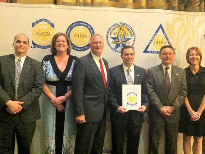 Aiken Public Safety was reaccredited Saturday in Mobile, Ala. The following posed for a photo with the award: Lt. Ben Harm (from left), Accreditation Coordinator Stephanie Christiansen, recently retired Director Pete Frommer, current Director Charles Barranco, Capt. Richard Abney and Master Public Safety Officer Jennifer Bickel.
