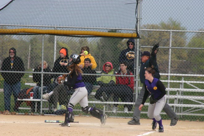 Canton catcher Michaela Kumer came out from behind home plate and made a perfect throw to first on a bunt laid down by Glenbrook South's Grace O'Gora in the third inning of the first game in their doubleheader on Monday. The Lady Giants improved to 4-1, winning 8-5 and 5-4.