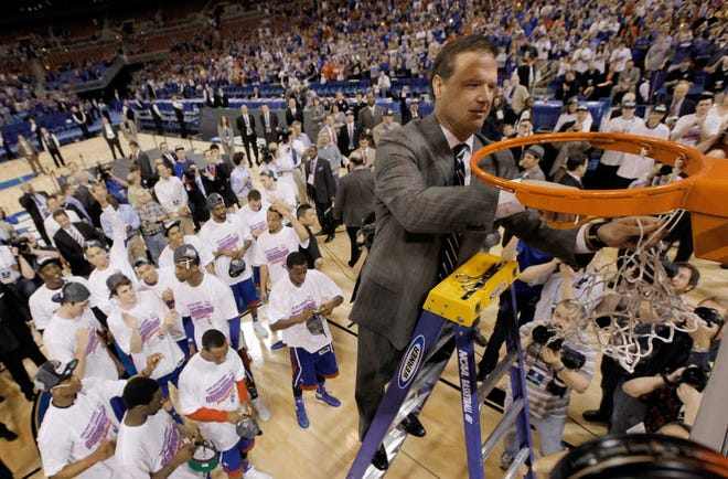 Kansas Jayhawks head coach Bill Self cuts the net after winning the NCAA tournament Midwest Regional final against North Carolina on Sunday in St. Louis. The Jayhawks making the Final Four was less of a sure thing this year than in many other seasons. That's prompted many fans and media to wonder if it is Self's best coaching job.