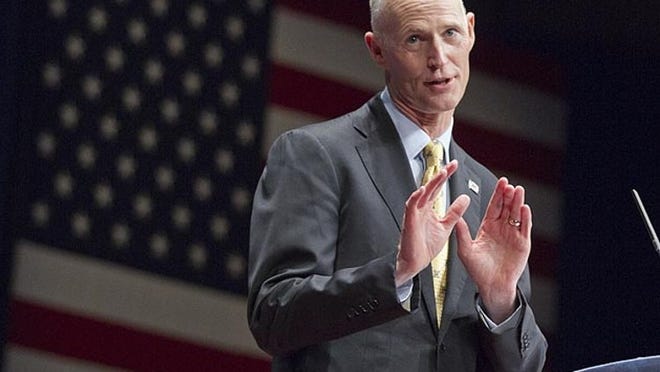 Gov. Rick Scott of Florida addresses activists from America's political right at the Conservative Political Action Conference (CPAC) in Washington, Saturday, Feb. 11, 2012.