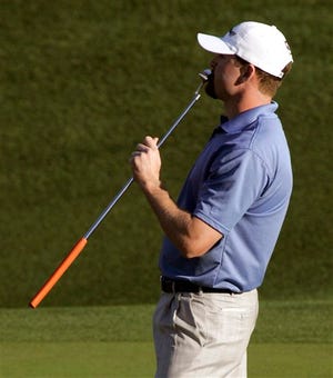 D.J. Trahan kisses his putter on the 16th green after hitting a long putt to within inches of the cup during the final round of the Bob Hope Classic golf tournament at Classic Club golf course in Palm Desert, Calif., Sunday, Jan. 20, 2008. Trahan won the tourney by one stroke with a five-day score of 26-under-par 334.(AP Photo/Don Ryan)