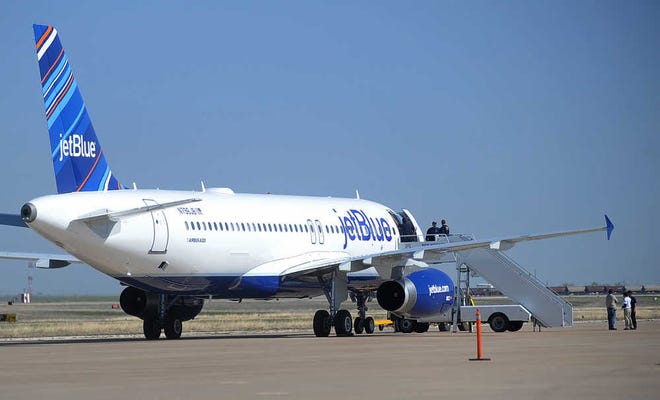 Authorities board JetBlue Flight 191 on Tuesday at Rick Husband Amarillo International Airport.