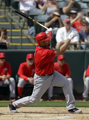 Darron Cummings Associated Press The Angels' Albert Pujols takes a cut during a spring training game against the Athletics in Phoenix on March 5.