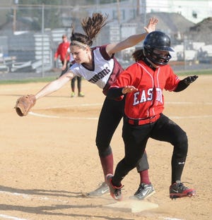Easton’s Alexa Barry beats the tag of Stroudsburg first baseman Kayla Humphreys during their non-conference softball game Friday. The Mounties held a two-run lead going into the 7th inning, but the Red Rovers rallied to capture a 4-2 victory.