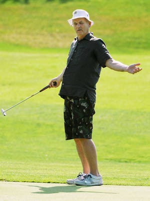 Bill Murray reacts to his putt on the ninth green Friday during the 12th. annual Caddyshack Golf Tournament.