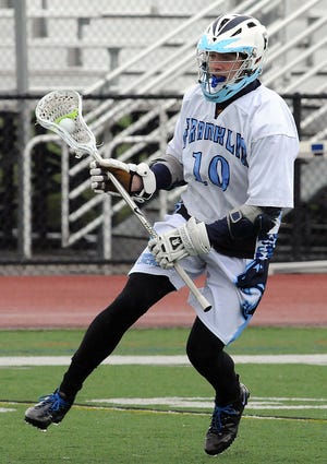Franklin's Mike Carlucci moves the ball against Falmouth yesterday
