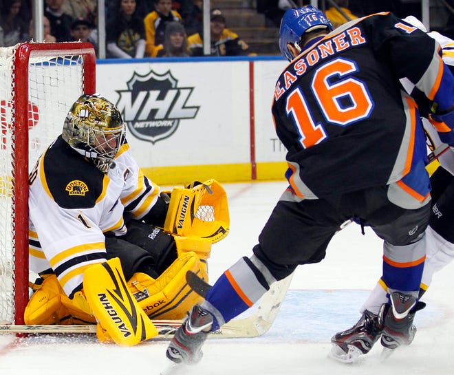 Bruins goalie Marty Turco (1) makes a save on a shot by the Islanders Marty Reasoner during the second period yesterday.