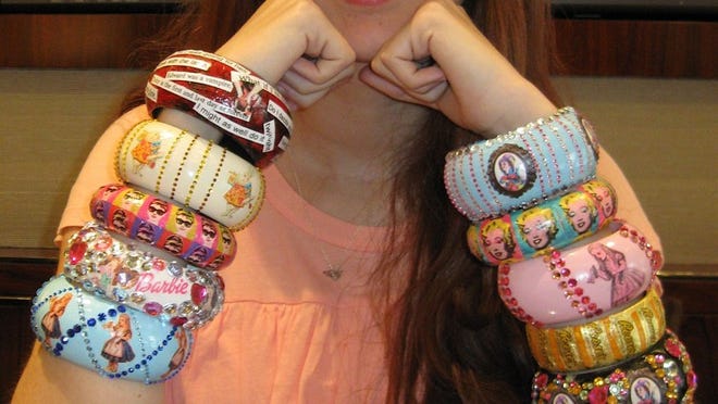 Charlotte Munder, who made $20,000 for the Make-A-Wish Foundation over the past year through sales of her hand-made bracelets, has designed a new assortment of the colorful cuffs.