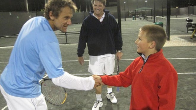 Jack McClusky, right, thanks Mats Wilander as Jack's father, Kevin, approaches. The McCluskys participated in a clinic by Wilander and Cameron Lickle at the Seaview Tennis Center.