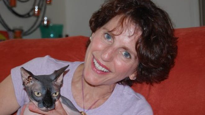 Melanie Bone’s cat Plum is a hairless combination of two uncommon cats.