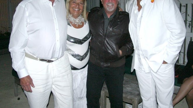 Peter Karlson, Danielle deBenedictis and Billy Joel help celebrity chef Todd English celebrate his 50th birthday in Nantucket.