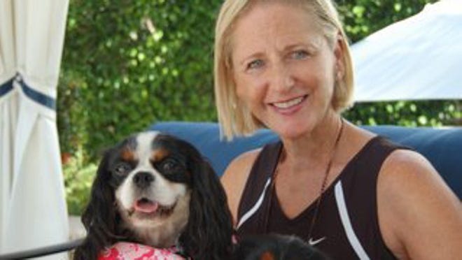 Susan Markin with her two Cavalier King Charles Spaniels, Abigail, left, and Phoebe.