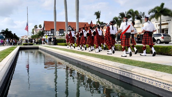 The Palm Beach Pipes and Drums perform at Memorial Fountain Park near Town Hall.