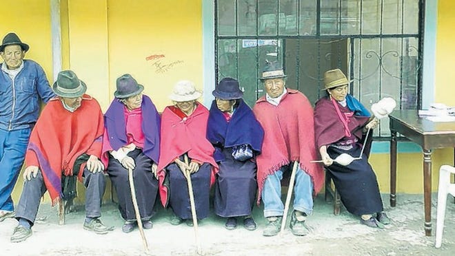 Quechuan Indians wait their turn at a medical clinic in Caliata, Ecuador.