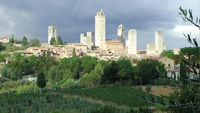 San Gimignano is an Italian town between Florence and Rome.