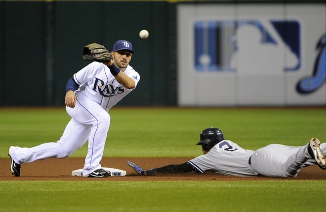 New York Yankees' Derek Jeter (2) steals second ahead of Tampa Bay Rays second baseman Sean Rodriguez left during the first inning on Wednesday.