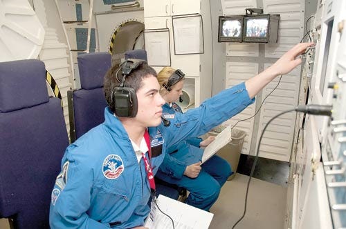 Submitted Photo - Sparta High School sophomore Eric Reinhard and Darby McAllister perform a mission on shuttle Sim.