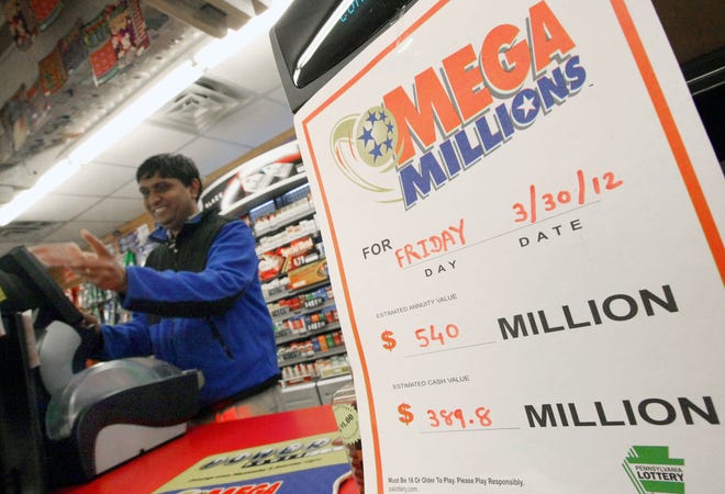 Owner Eddie Patel sells Mega Millions tickets at Main Street Convenience in Larksville, Pa., Thursday, March 29, 2012. The jackpot was at $540 million Thursday evening.