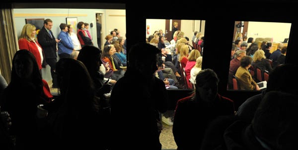 After they were turned away from the Pocono Mountain School Board meeting in Swiftwater on Wednesday, February 15, 2012, more than 50 people, mostly school district teachers and staffers, stood outside for the duration of the meeting.