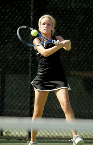 Lakeland's Ally Campbell hits a backhand against George Jenkins' Caitlin Ryan.