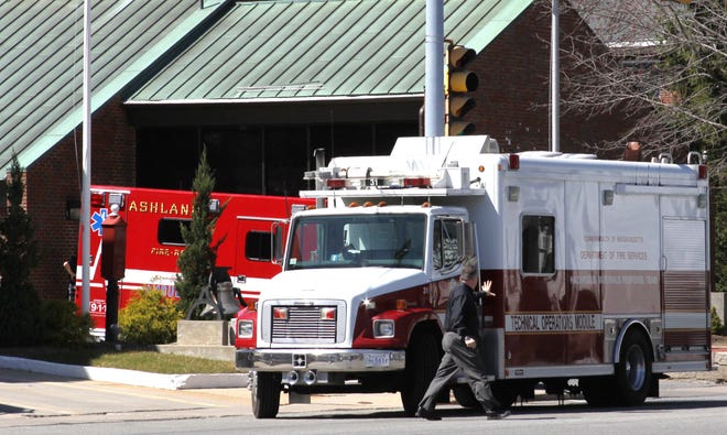 A hazmat truck is parked outside the Ashland Police Station today after a package containing a white powder was brought there. The building was quarantined for two hours until the powder was found to be harmless. Photo by Dick Bartlett