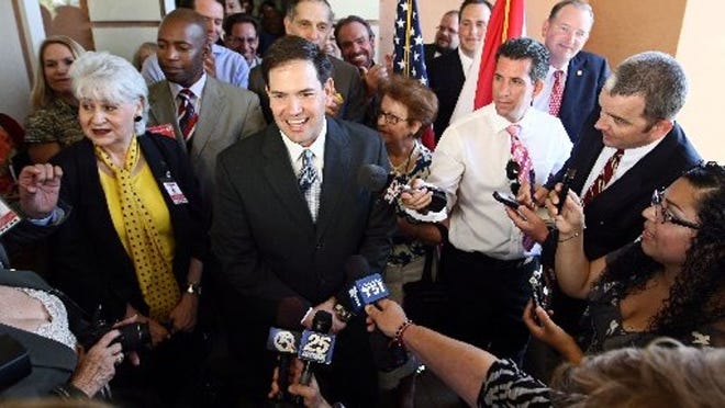 Senator Marco Rubio speaks to a crowd as he opens a Palm Beach Regional Office in the PGA Commons Plaza Wednesday April 4, 2012.