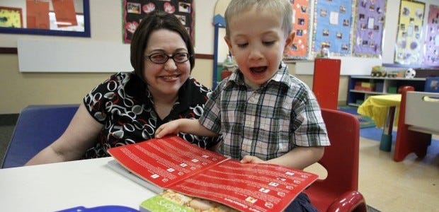 Kelly Andrus plays with her son, Bradley, in his classroom at Children's Choice Learning Centers Inc. in Lewisville, Texas. Bradley, who turns 3 in a couple of weeks, was diagnosed a year ago with mild autism. For the first time in nearly two decades, experts want to rewrite the definition of autism. Some parents fear that if it's narrowed and their kids lose the label, they may also lose out on special therapist.