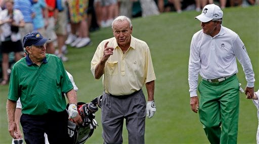 Jack Nicklaus, left and Gary Player listen to Arnold Palmer, center, during the par 3 competition at the Masters golf tournament Wednesday, April 4, 2012, in Augusta, Ga. (AP Photo/David J. Phillip)