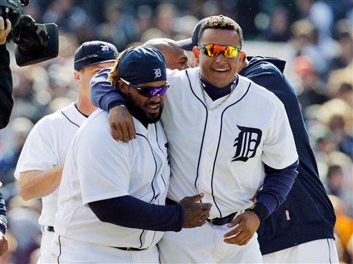 Detroit Tigers' Prince Fielder, left, and Miguel Cabrera walk off the field after their 3-2 win over the Boston Red Sox in a baseball game in Detroit, Thursday, April 5, 2012.