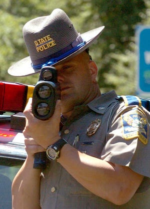 Connecticut State Trooper Greg Trahan looks for speeders at the Connecticut line on I-395 south in Thompson.