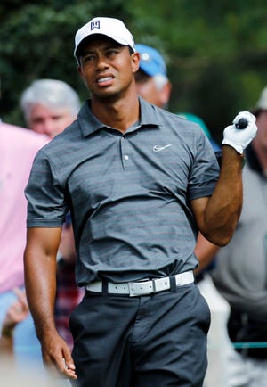 Tiger Woods watches his tee shot on the 15th hole during the first round of The Masters on Thursday in Augusta, Ga.