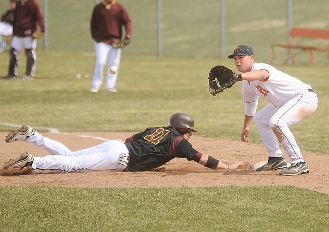 Hope's Colton Bodrie (8) tries to tag Calvin's Andrew Bosma (11) out during their game Thursday afternoon at Hope College.