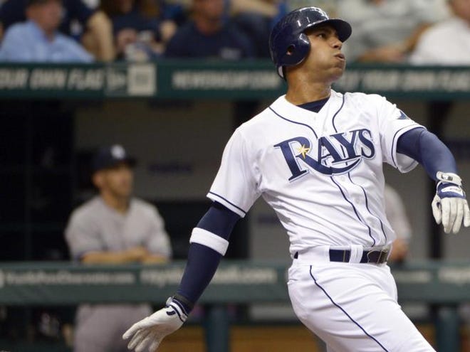 Tampa Bay Rays' Carlos Pena watches the flight of the ball after hitting a grand-slam home run during the first inning of a baseball game against the New York Yankees in St. Petersburg, Fla., Friday, April 6, 2012. (ASSOCIATED PRESS)