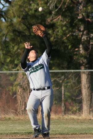 Luke Hart catches a pop up at first base for the Weed Cougars Friday, April 6, 2012 at Son's Park in Weed.