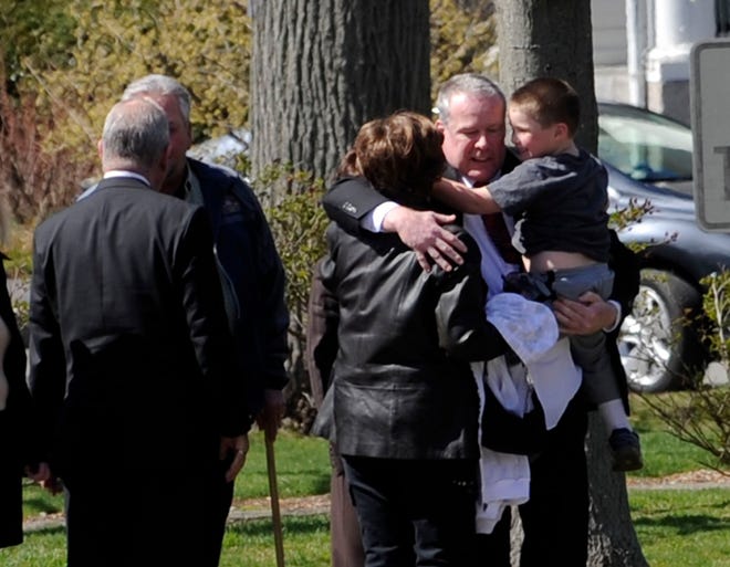 Former murder suspect Daniel Bradley hugs family members following his release from prison. The D.A. dropped the murder charge against the Westwood resident on Friday, April 6, 2012.