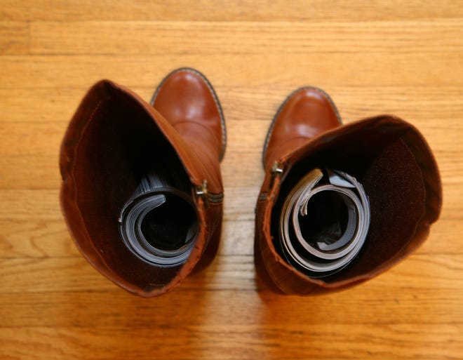 Rolled-up magazines are one way to keep boots standing tall.
