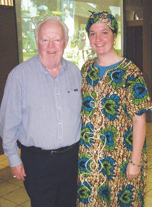 Bureau Valley fourth grade teacher Suzy Bell is shown with Kewanee Rotary Club member Jerry Rux after giving a program at this week's club meeting on her two-week teaching mission to Liberia in 2010. She is wearing a dress and head scarf given her during the trip.