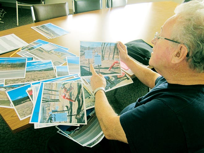 West Bloomfield Town Supervisor John Champlin shows photos from a recent trip he made to Tioga County, Pa., where small communities are hosting fracking operations.