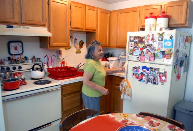 Mary Delgaldo shows the kitchen at her apartment at the AHEPA property on Hamilton Avenue in Norwich. Delgado’s apartment is one of 50 that will get new cabinets and a refrigerator this summer.