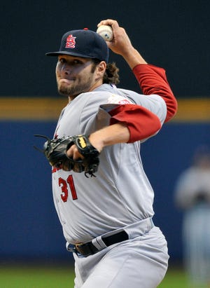 St. Louis' Lance Lynn delivers a pitch in the first inning against the Milwaukee Brewers on Sunday.