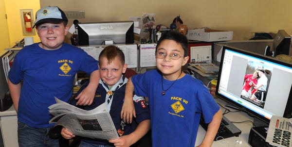 Three lucky Cub Scouts got a tour and lesson in journalism at the Pocono Record on Monday, April 9, 2012. From left, Jacob Smith, 8, Dylan Blose, 9, and Douglas Mackenzie, 9, all members of Pack 90 in Pocono Pines, hang out at the Pocono Record Monday morning.