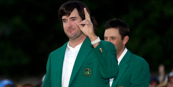Masters champion Bubba Watson waves to the crowd after receiving his green jacket following his sudden death playoff victory over Louis Oosthuizen.