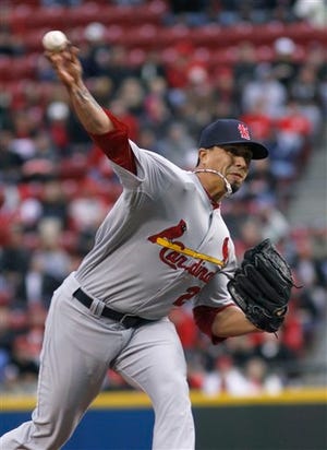 St. Louis Cardinals Kyle Lohse pitches against the Cincinnati Reds in the first inning of their baseball game in Cincinnati on Tuesday.