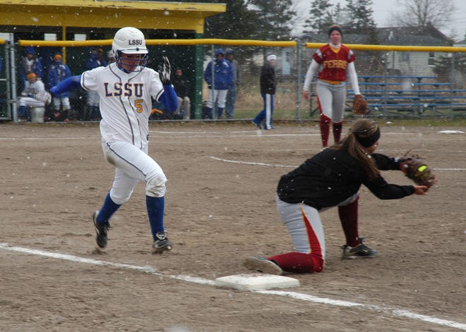 Lake Superior State’s Heather Cuthrell (5) is thrown out in a close play at first base against Ferris State during a GLIAC softball game Tuesday. The Bulldogs swept the Lakers 7-1 and 9-0.