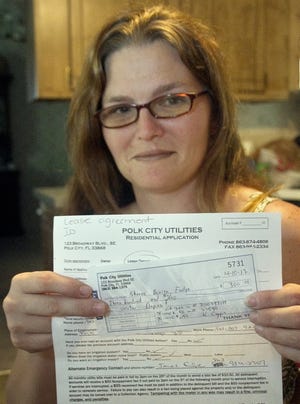 Polk City resident Shanna Fudge was the person to benefit from a new city ordinance that lowered her application fee for water and sewer service.