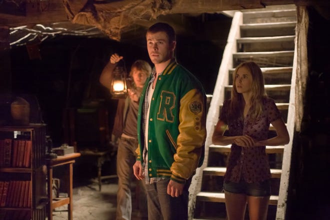 Marty (Fran Kranz, left), Curt (Chris Hemsworth, center) and Jules (Anna Hutchison) in "The Cabin in the Woods."